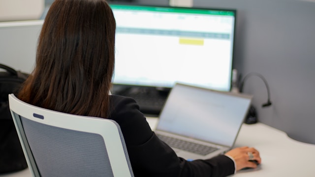 woman working on computer with Excel